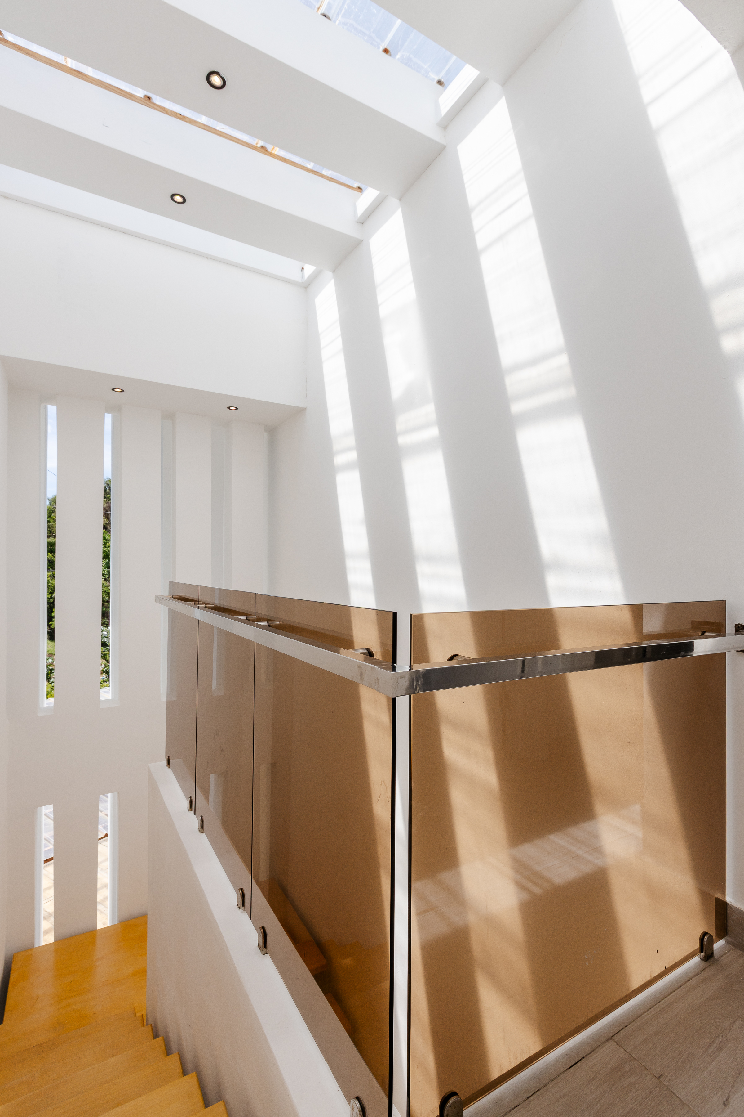 Double-height entrance atrium with bronze glass balustrade